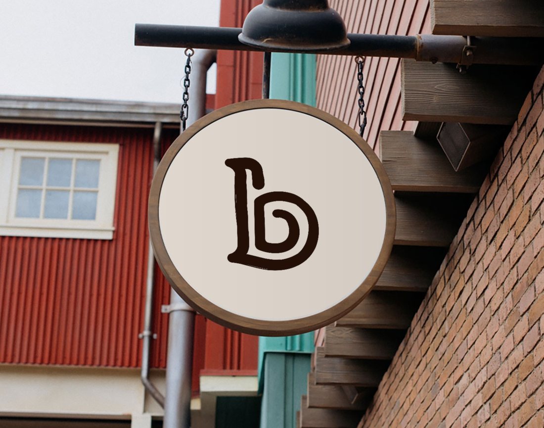 Round hanging sign with the Baker Street b mark